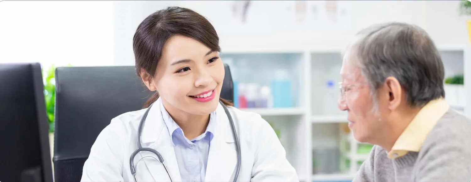 A doctor consulting with an elderly patient